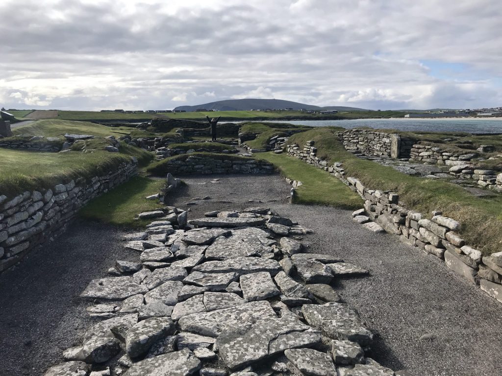 Standing inside the remains of a Viking longhouse, Jarlshof, Shetland