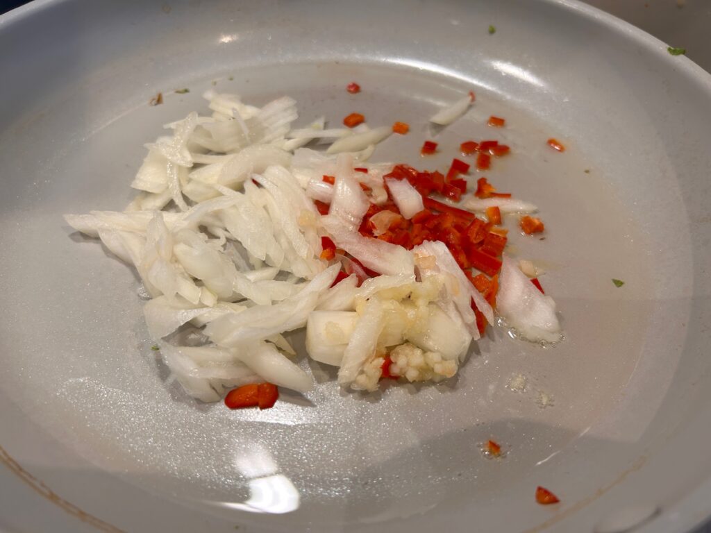 Indonesian sticky tempeh stir fry - heat the garlic onions and chilli